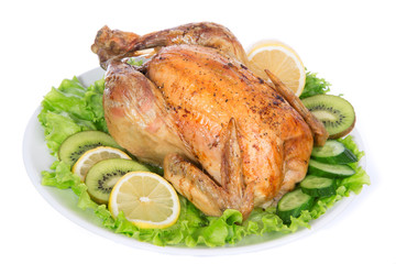 Garnished roasted chicken on a plate