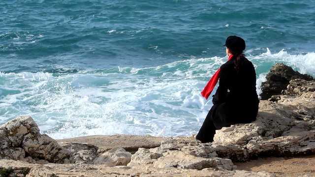 Sea, red scarf and wind
