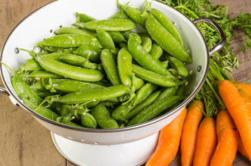 Fresh green peas and carrots