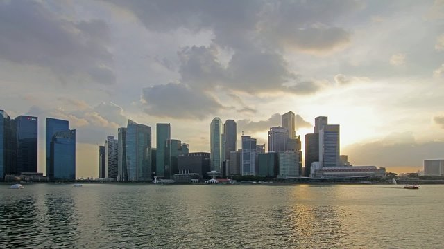 Singapore Skyline with Fast Moving Clouds at Sunset Timelapse