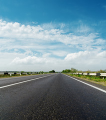 asphalt road and cloudy sky