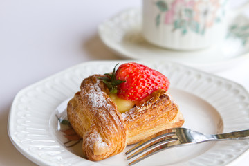 Strawberry Danish on china plate