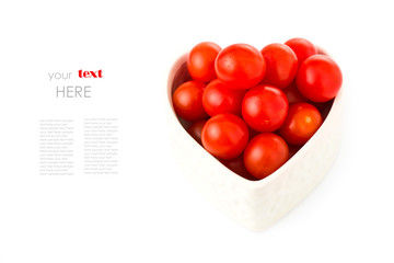Naklejka na ściany i meble Red tomatos in a heart shape