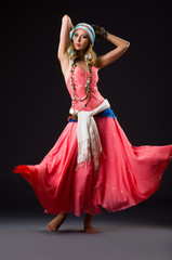 Fototapeta premium Woman dancing spanish dances on white