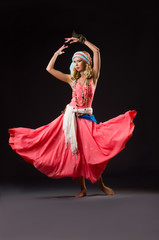 Fototapeta premium Woman dancing spanish dances on white