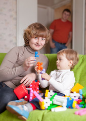 mother and child plays with toys