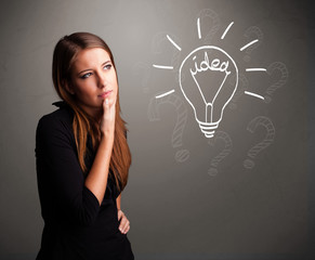 Young girl comming up with a light bubl idea sign