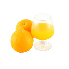 Orange juice in brandy glass and two fruit on white background.