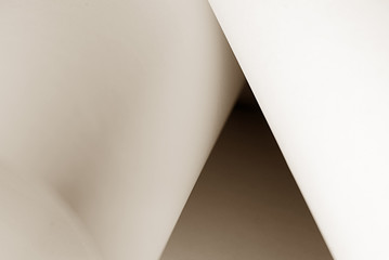 An abstract closeup photo of curve shapes made up of paper