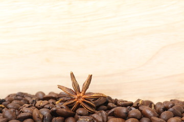 coffee beans on wooden surface background