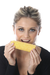 Model Released. Young Woman Eating Corn on the Cob