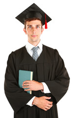 Young graduation man with book, isolated on white