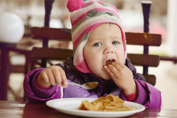 eating  toddler girl