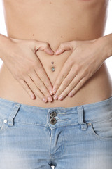 Fototapeta premium Model Released. Healthy Fit Young Woman Heart Shape on Tummy
