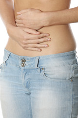 Naklejka premium Model Released. Young Woman Holding Tummy
