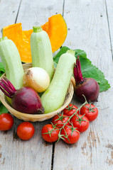 Fresh vegetables on the wooden background