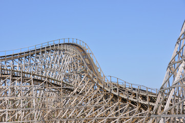 Close view on the construction of a large wooden rollercoaster