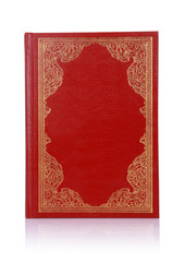 Old red book with gold color ornament on cover isolated on white