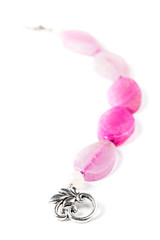 Handmade bracelet with pink oval gemstones on white