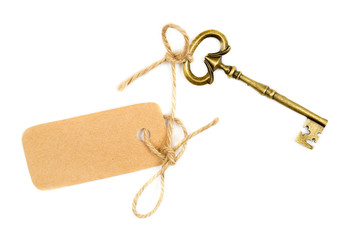 Vintage key with a tag on white