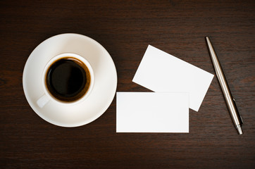 Coffee, business card and pen
