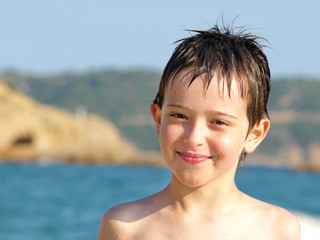 Fototapeta na wymiar playing boy in the water