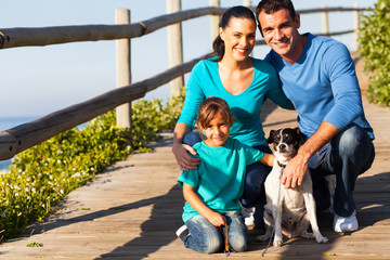 young family with pet dog