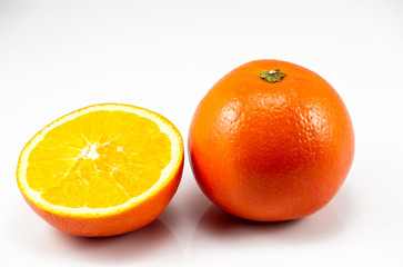 One and half oranges on the white background