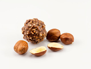 Chocolate and nuts on the white background