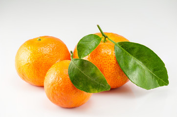 Three oranges on the white background