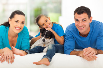 loving family lying on bed