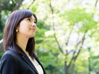 beautiful asian businesswoman in the park
