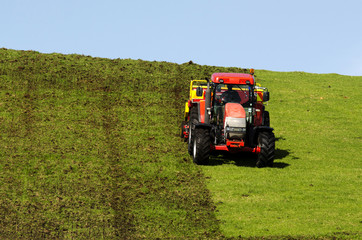Obraz premium Tractor plowing the ground