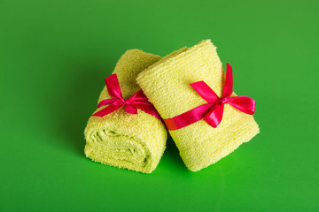 rolled up green beach towel