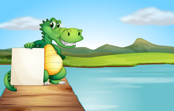 An alligator holding an empty board at the wooden bridge