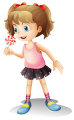 A child holing a lollipop candy