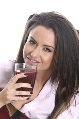 Model Released. Young Woman Drinking Pomegranate Juice