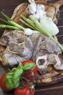 Osso buco, roasted and served with organic vegetable