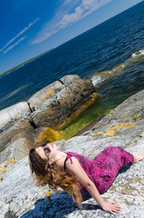 Teen girl relaxing on a sea coast