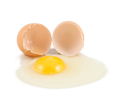 Cracked egg shell with yolk and protein