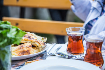 breakfast table with tea glasses on it