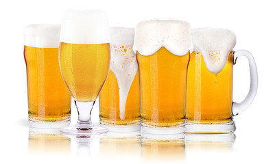 Frosty glass of light beer set isolated