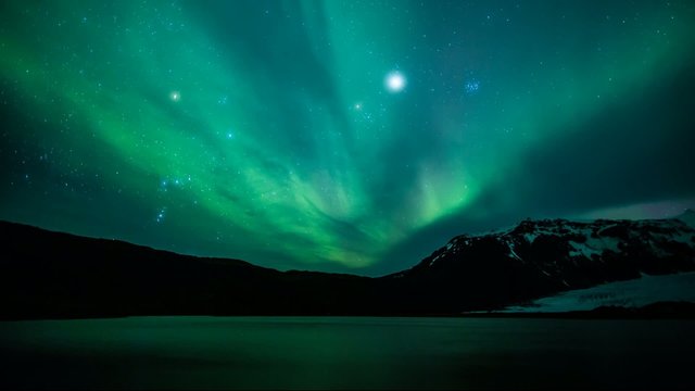 Northern lights (Aurora borealis) over the lake, Iceland