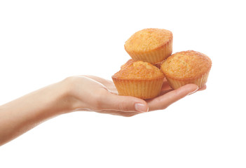 Hand holding heartshape cakes, isolated on white background