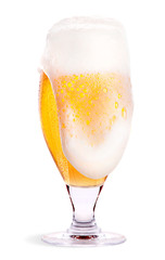 Frosty glass of light beer isolated
