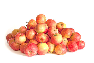 Heap of striped red apples isolated on white