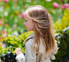 Little girl outdoors on spring day