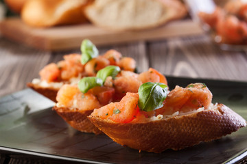 Bruschetta with mozzarella and tomato. Selective focus