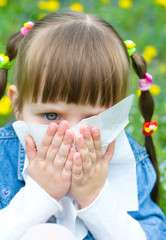 Obraz premium girl is blowing her nose