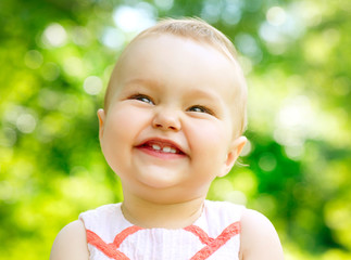 Little Baby Girl Portrait outdoor. Child over nature background